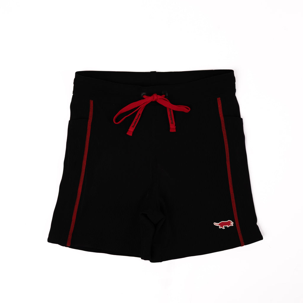 Black shorts with red accents on a white background
