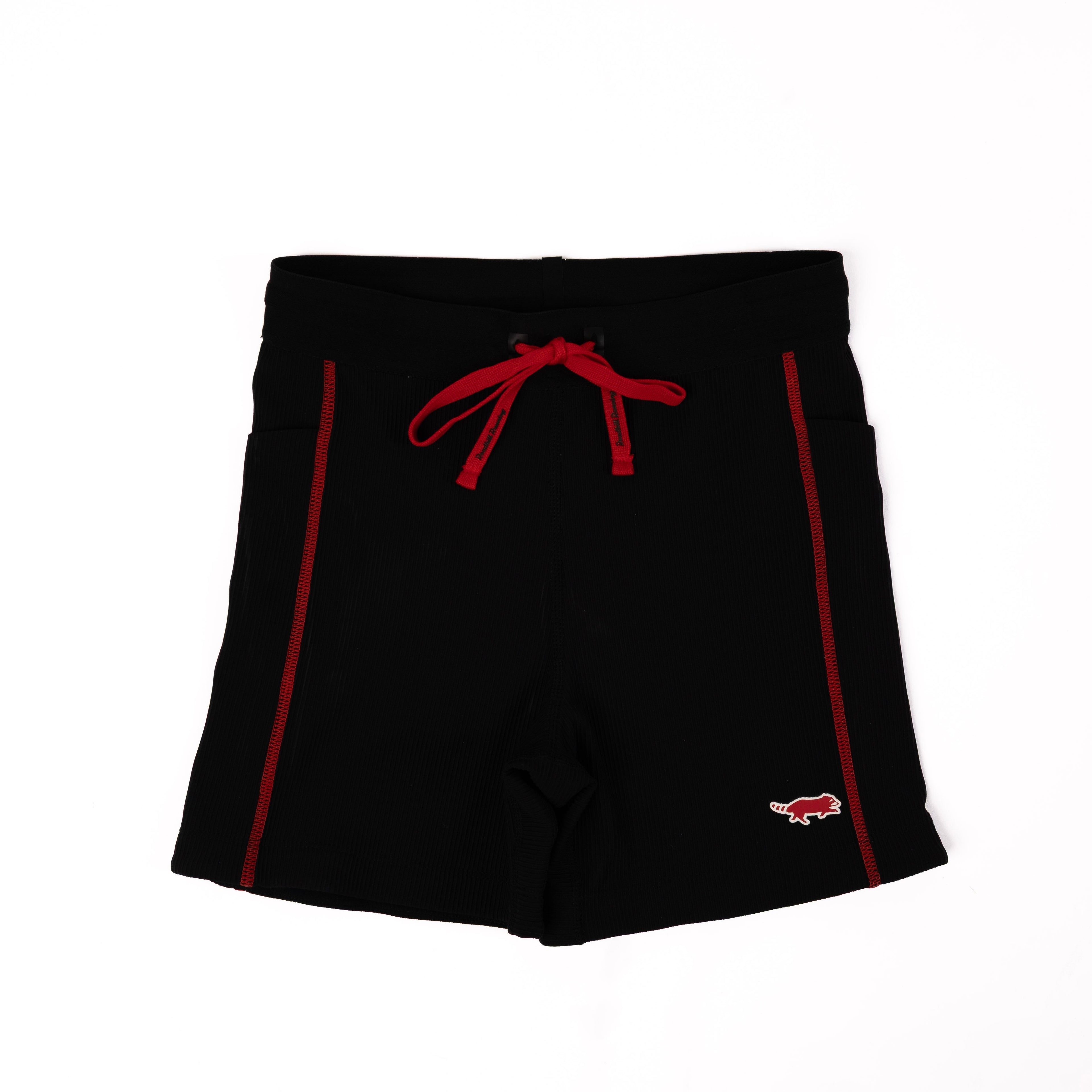 Black shorts with red accents on a white background